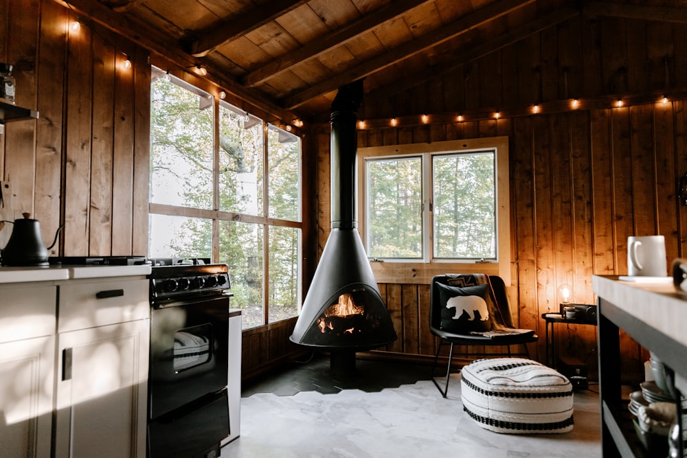 a room with a stove and a chair in it
