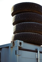 Close-up of rugged forklift tyres stacked and ready for shipment.