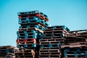 a pile of wooden pallets stacked on top of each other