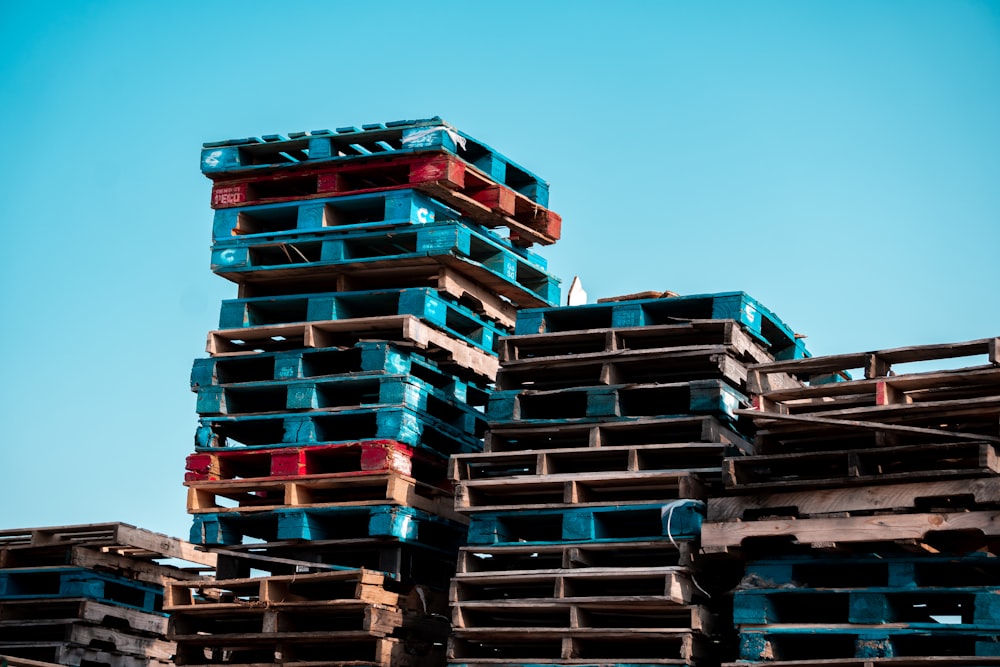 a pile of wooden pallets stacked on top of each other