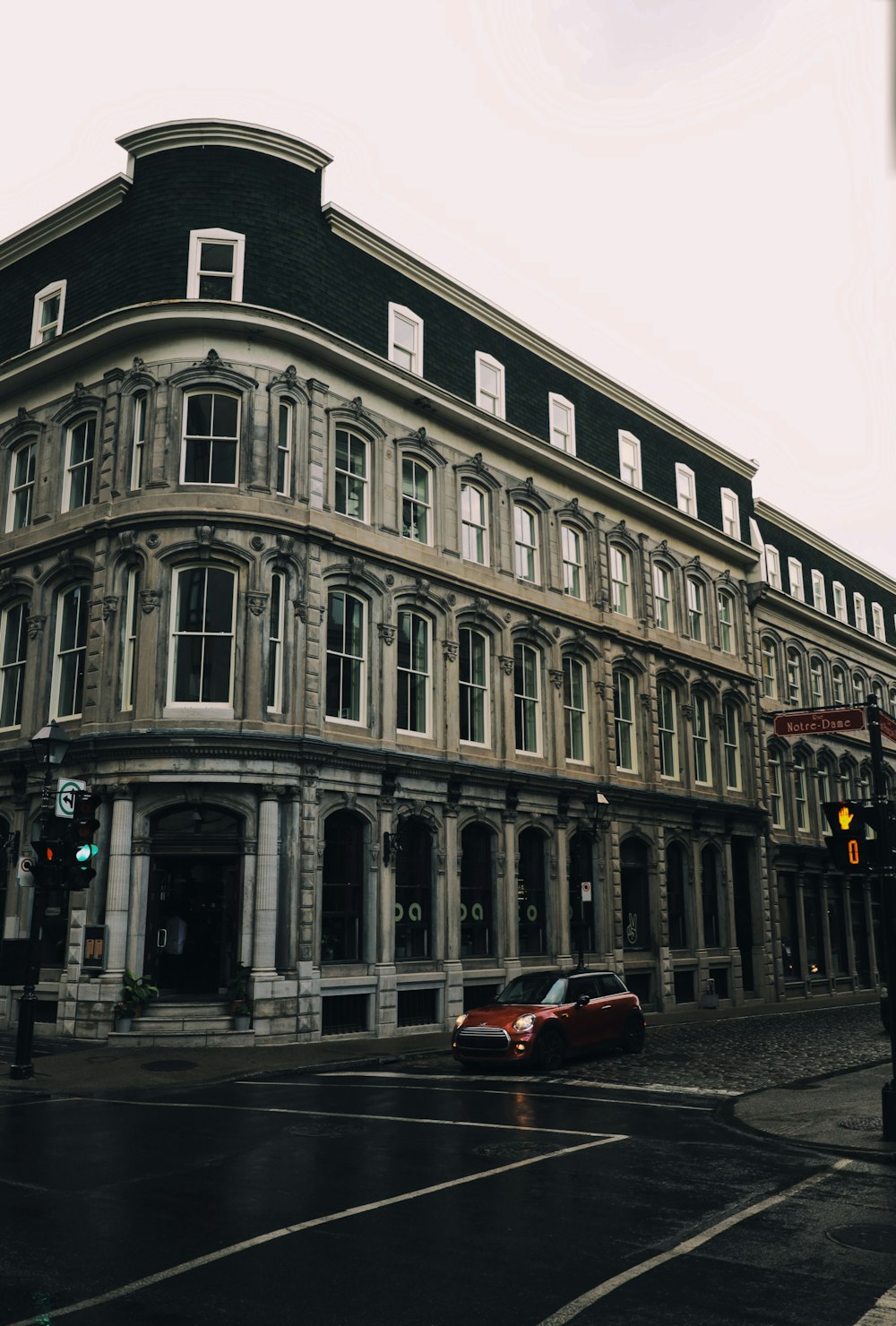 a large building sitting on the corner of a street