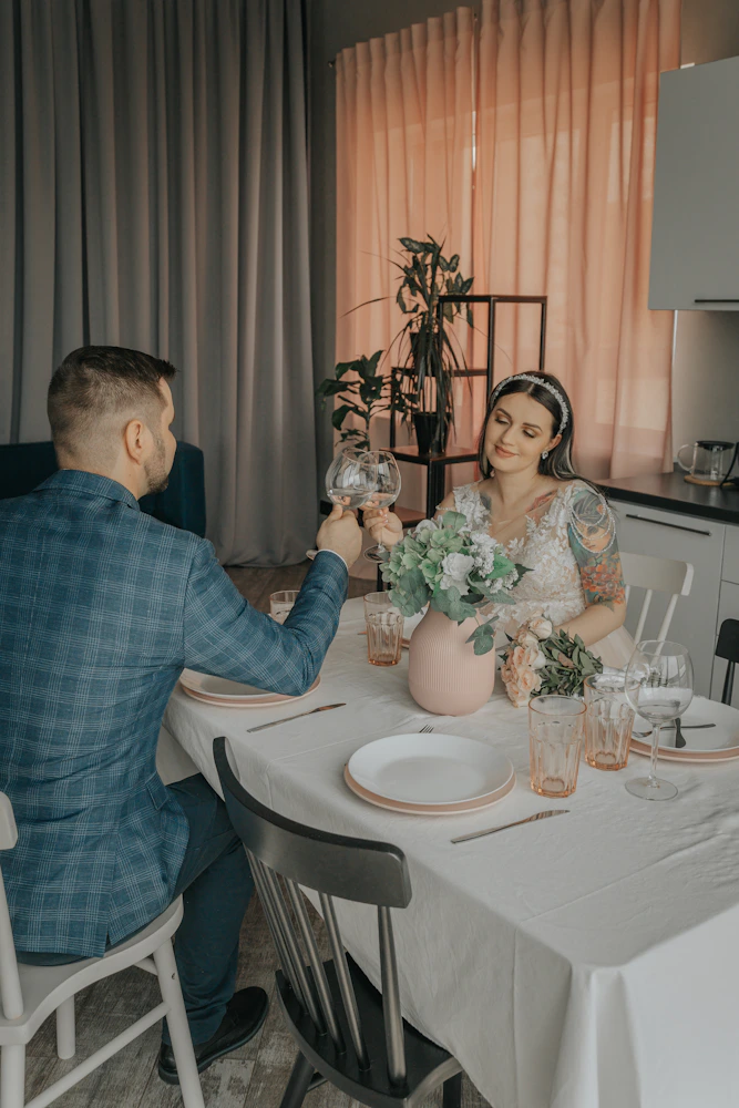 Wedding couple at candlelit dinner