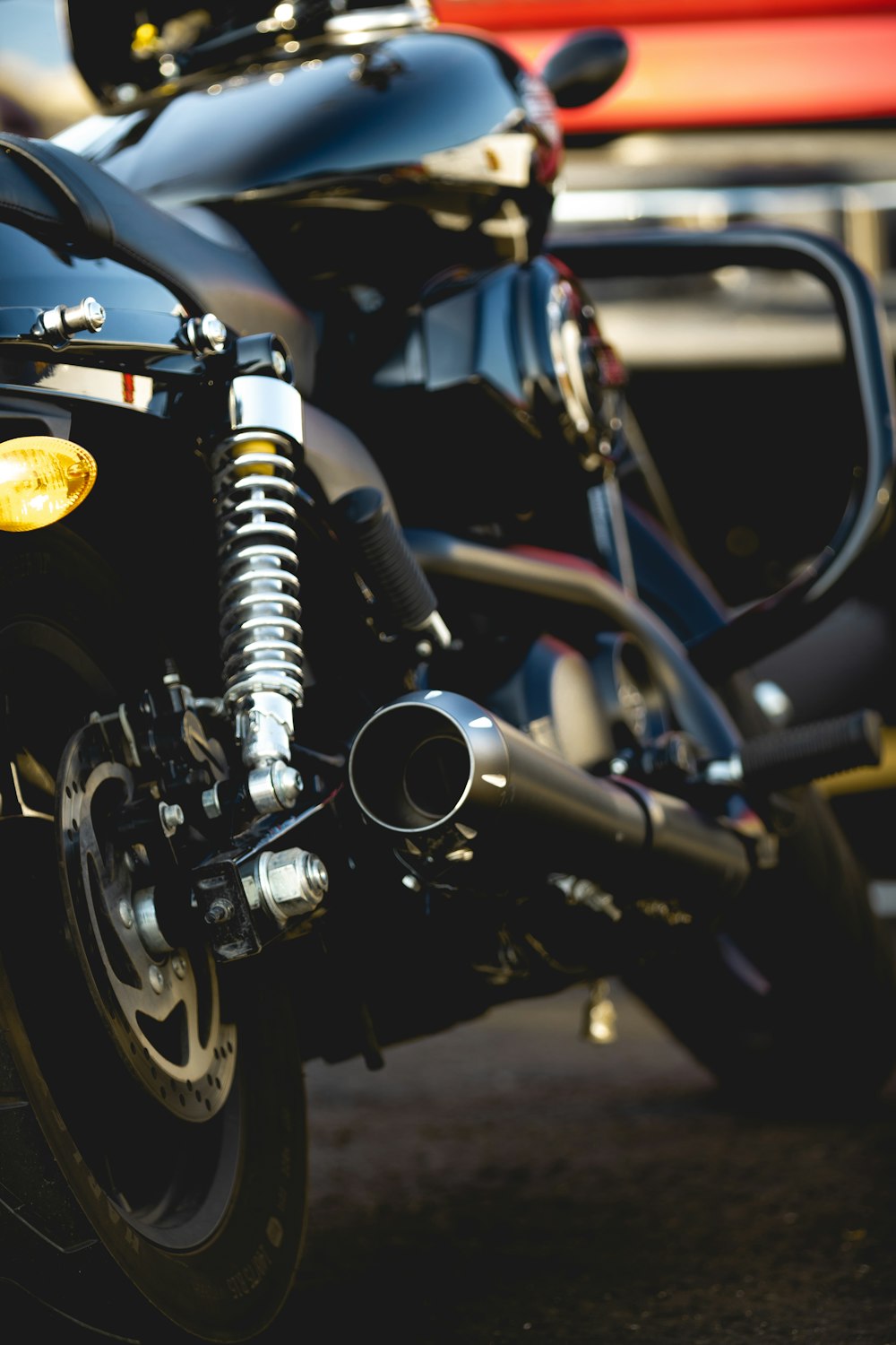 a close up of a motorcycle parked in a parking lot