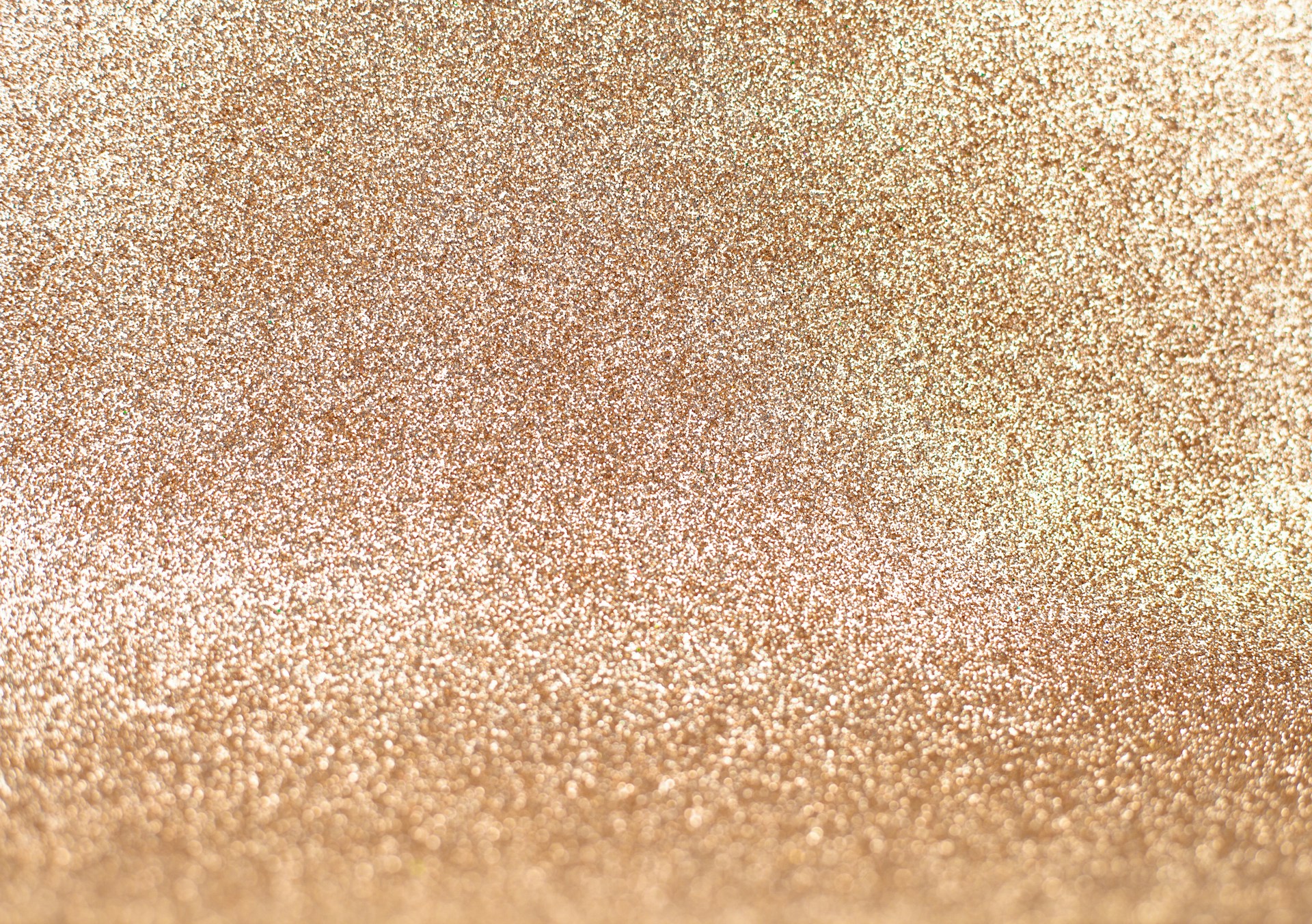 a close up of a gold glitter background
