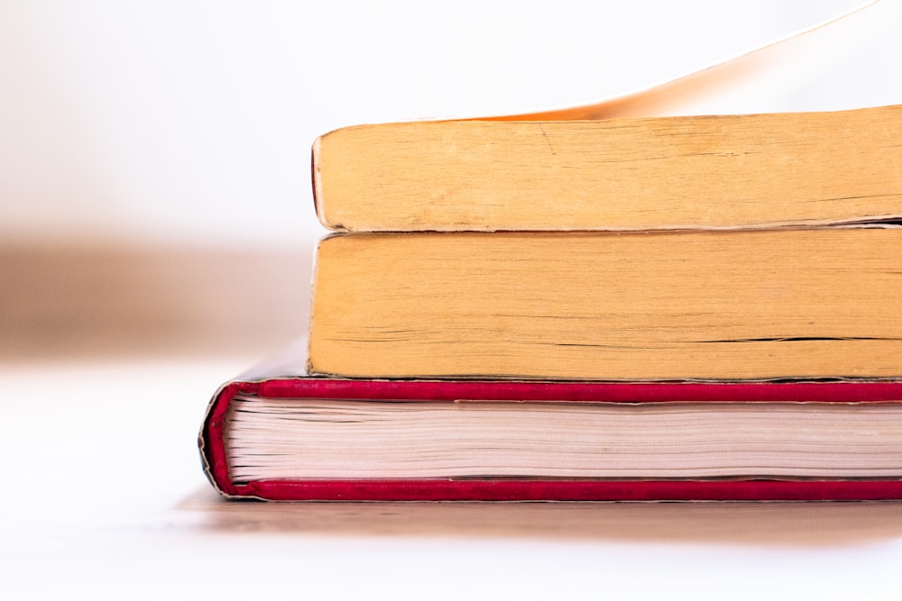 a stack of books sitting on top of each other