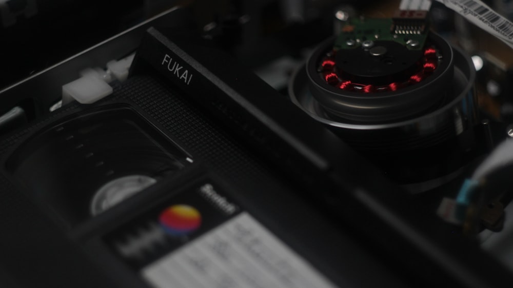 a close up of a computer with a red light on it