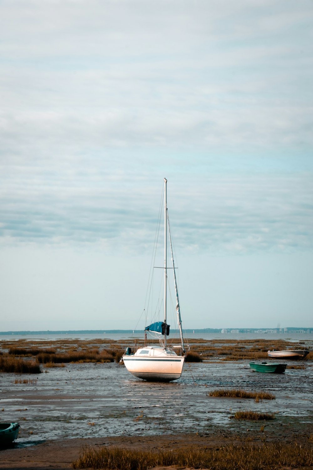 a sailboat sitting on top of a body of water