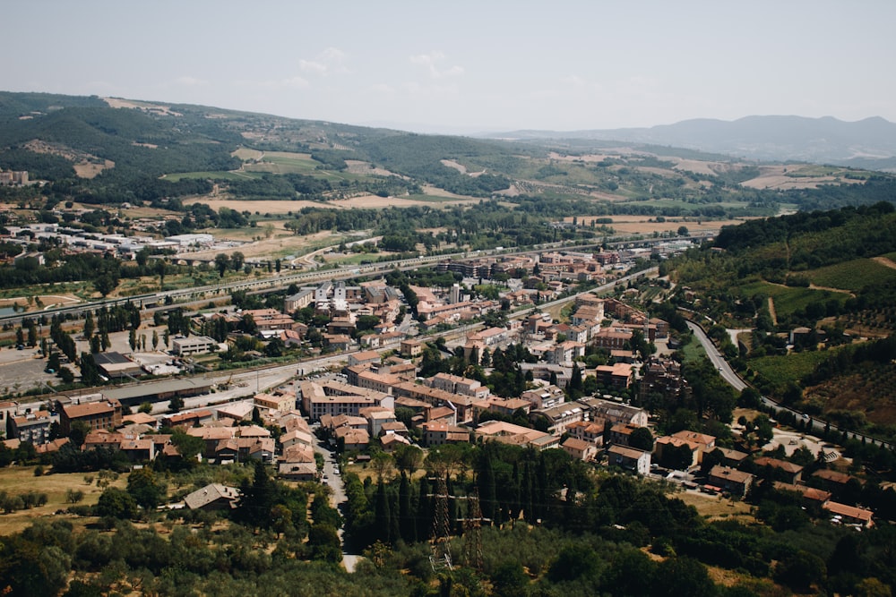 an aerial view of a small town in the mountains