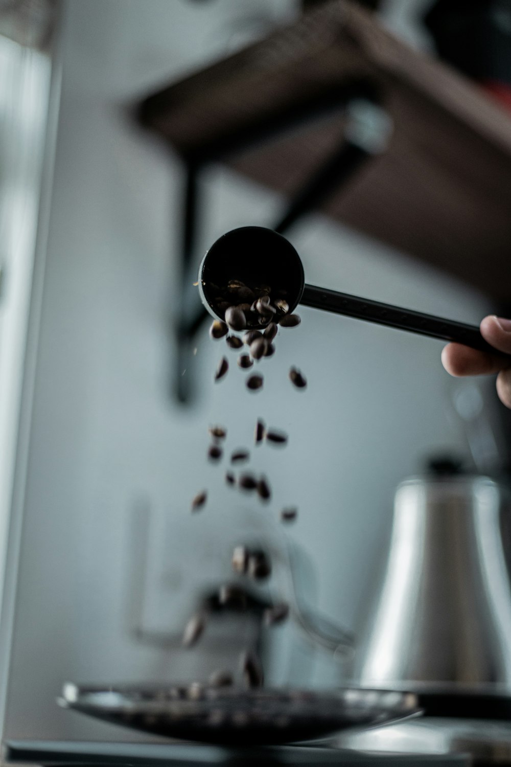 a person is sprinkling seeds from a spoon