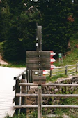 A rustic wooden signpost marking one of the 26 stages of the Rousseau trail.
