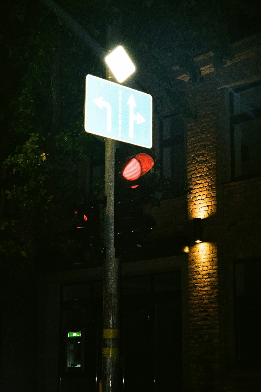 a street sign is lit up at night