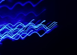 a blurry photo of blue lights in the dark