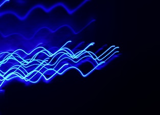 a blurry photo of blue lights in the dark