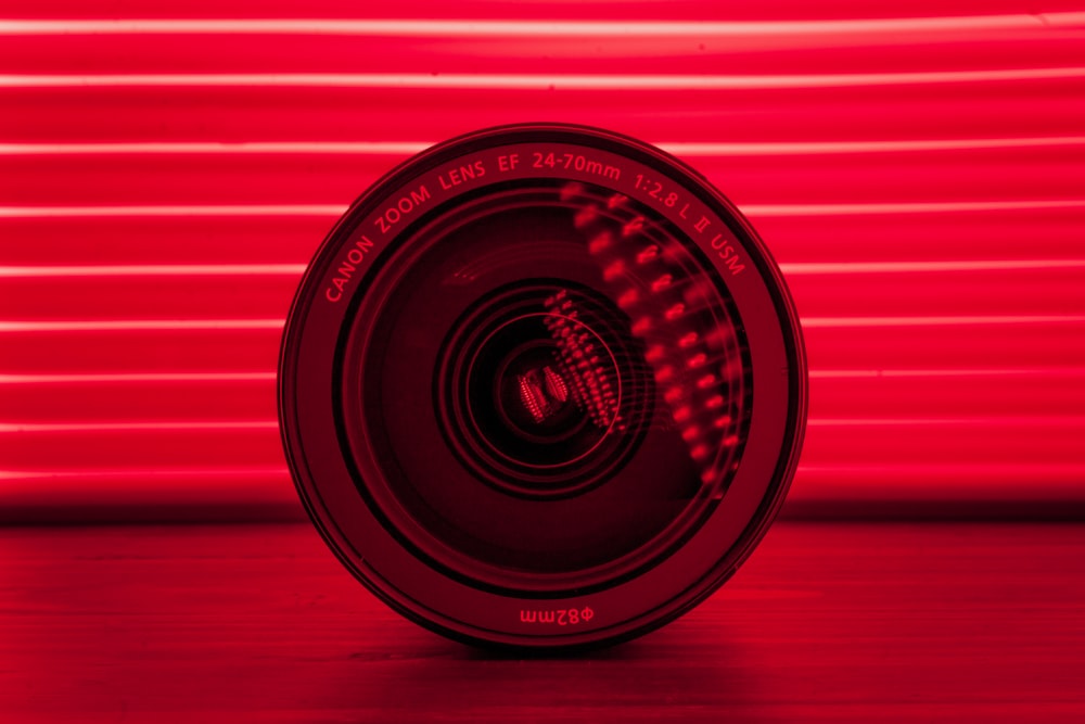 a camera lens sitting on top of a wooden table