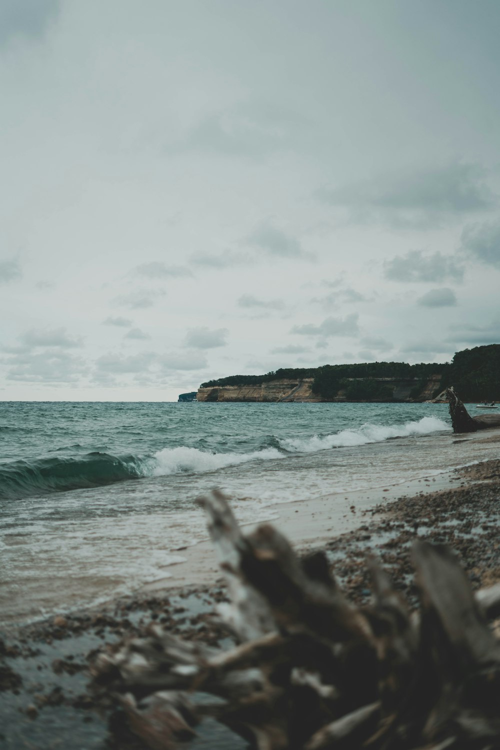 a beach with waves coming in to shore