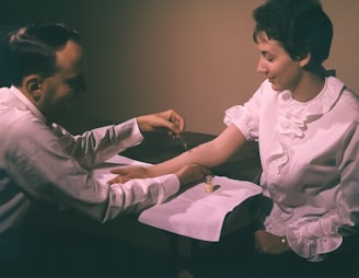 a man and a woman sitting at a table