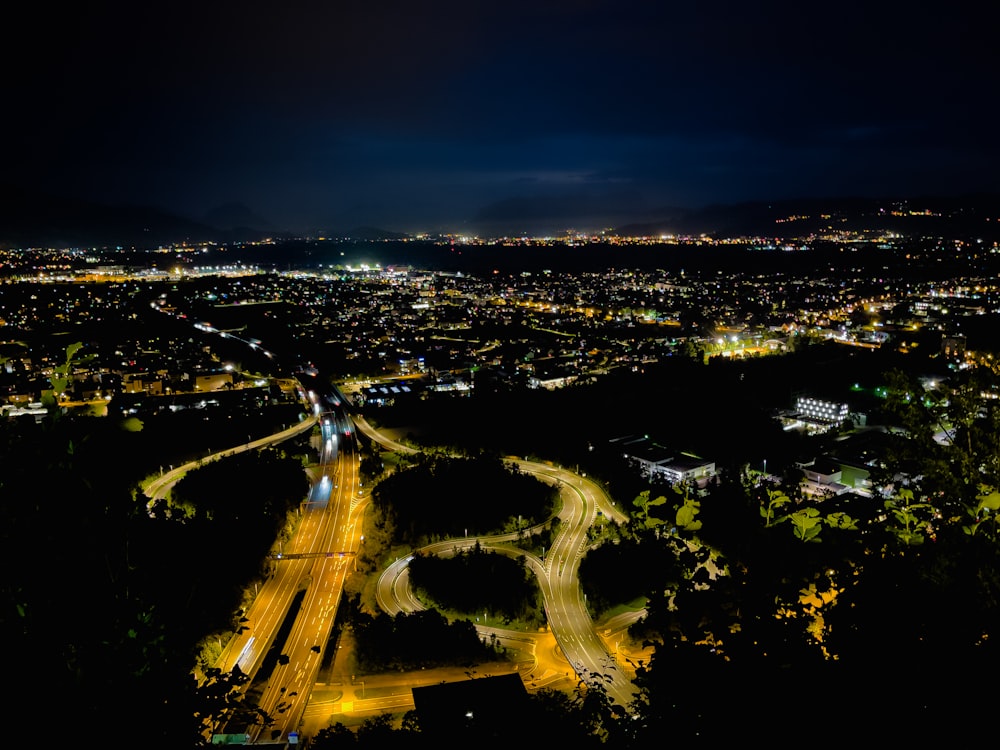 an aerial view of a city at night