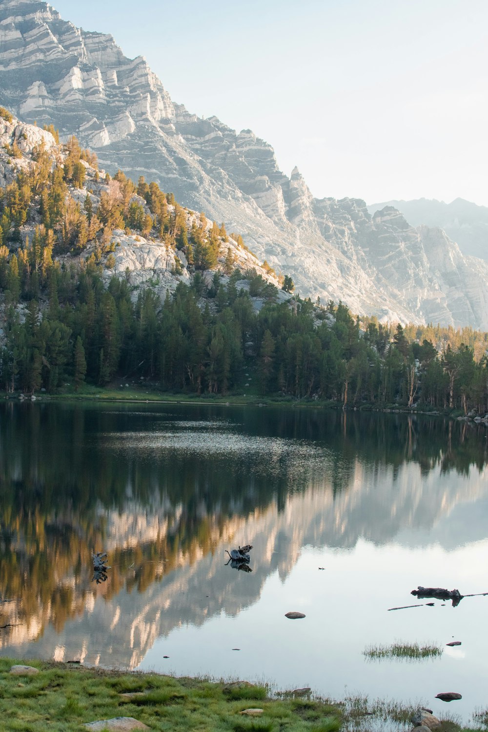 a lake surrounded by mountains and trees