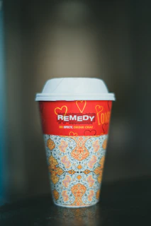 a cup of coffee sitting on top of a table