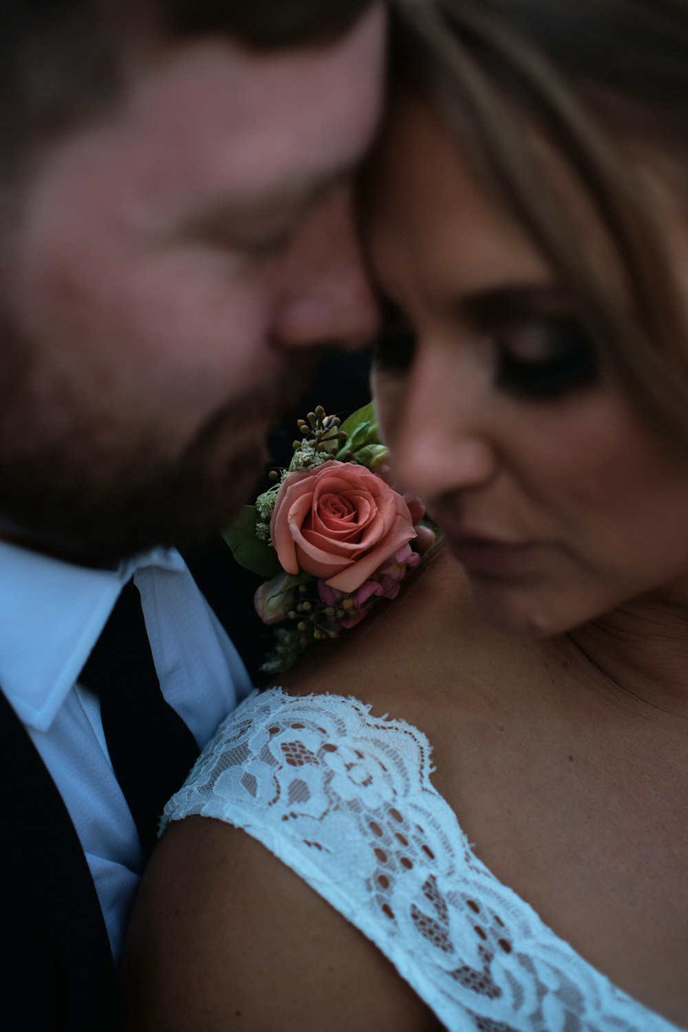 a man and a woman with a rose in their lapel