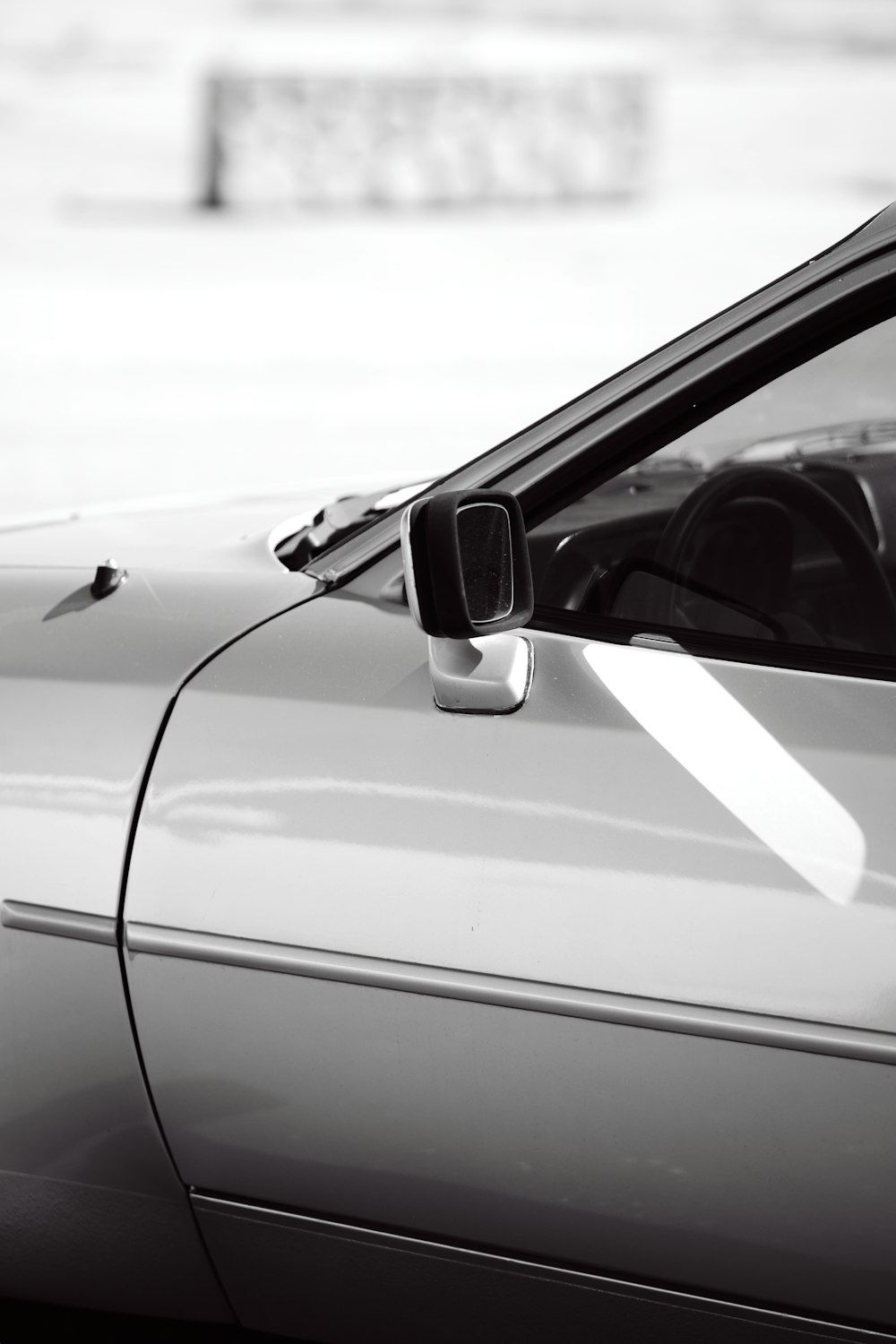 a black and white photo of a car door handle