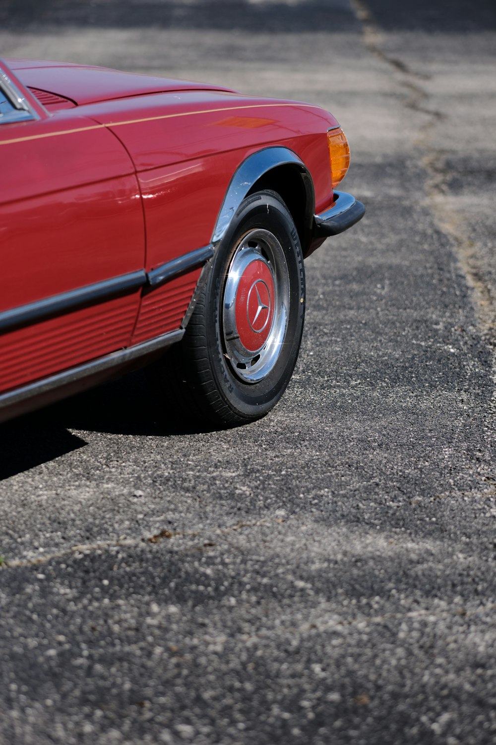 a red car parked in a parking lot