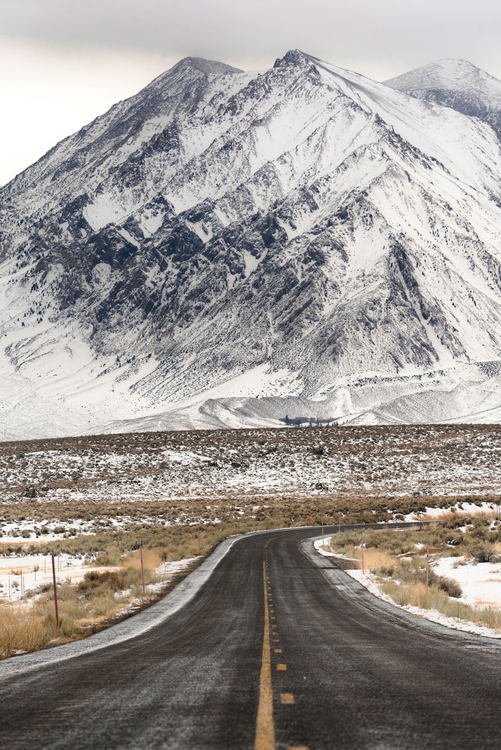 a snow covered mountain sits in the distance