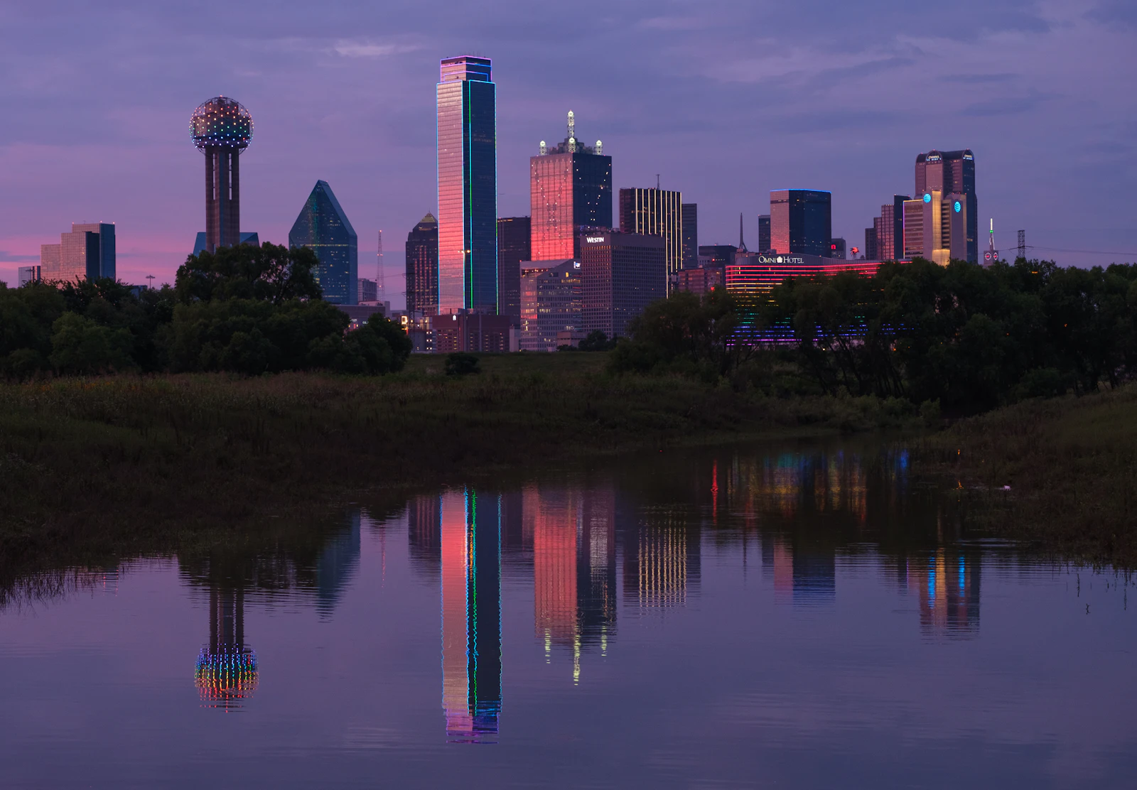 Downtown Dallas at dusk, seen across the Trinity River