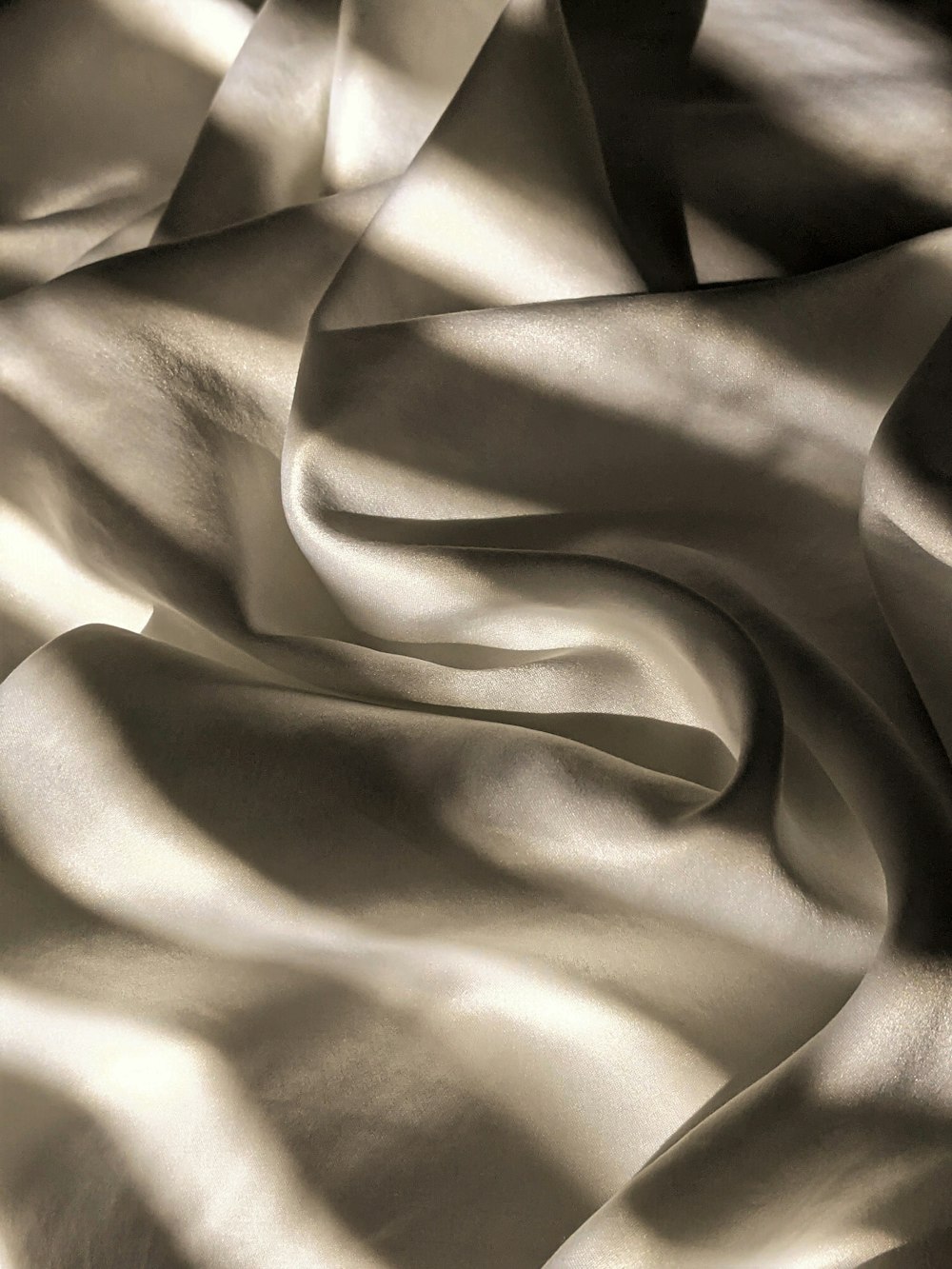 a black and white photo of a satin fabric