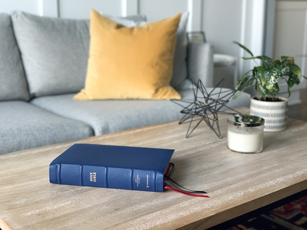 a blue book sitting on top of a wooden table