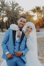 a bride and groom posing for a picture