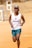 A happy runner wearing Flvrun gear during a training session.
