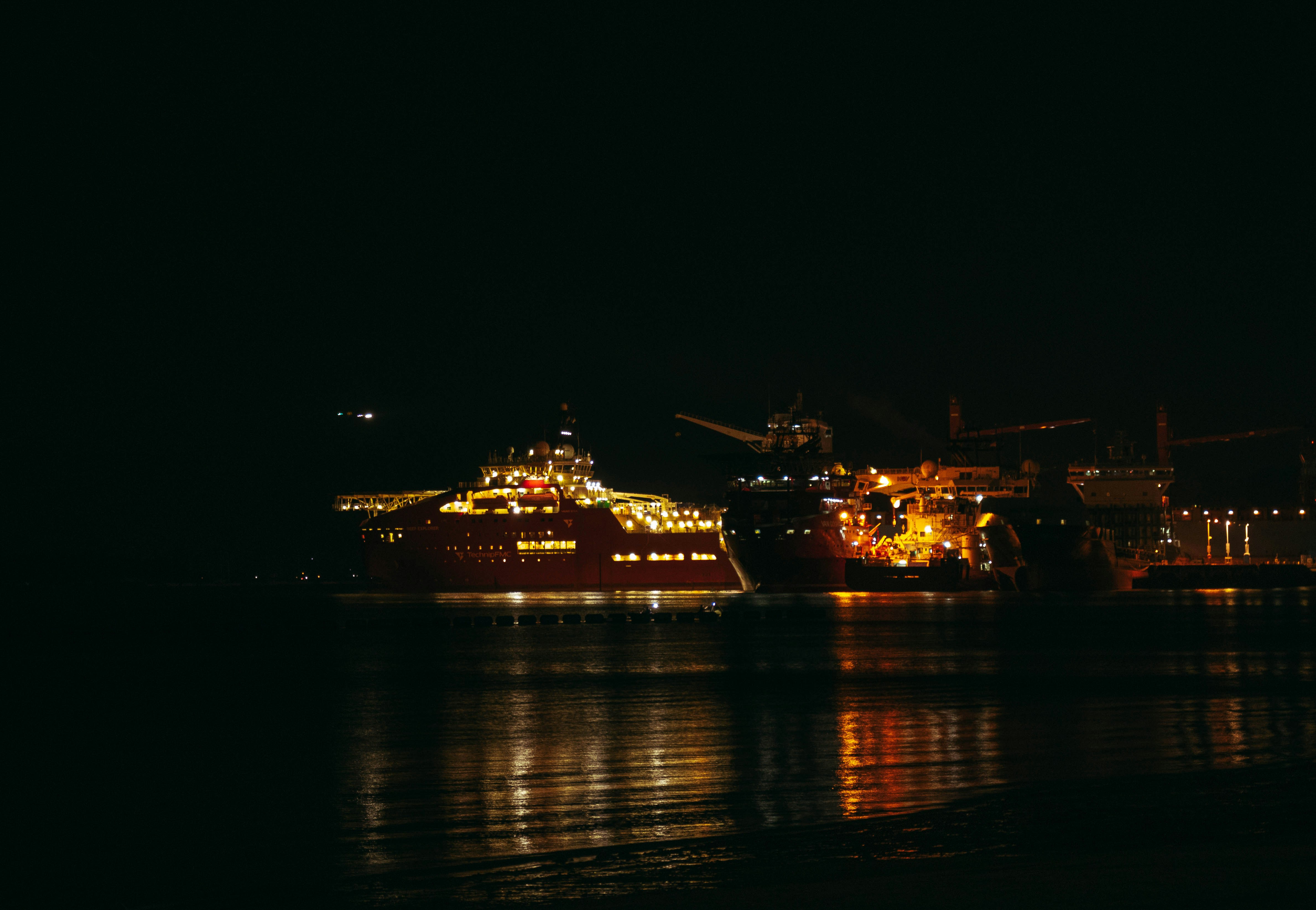 a large ship in the water at night