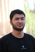 a man with a beard and a black shirt