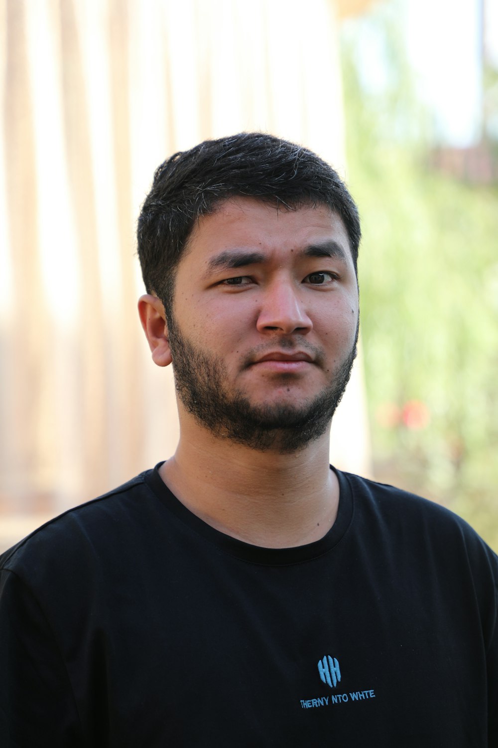 a man with a beard and a black shirt