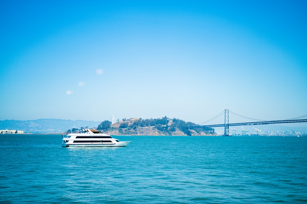 a large white boat floating on top of a large body of water