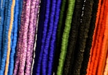 a close up of a bunch of different colored strings