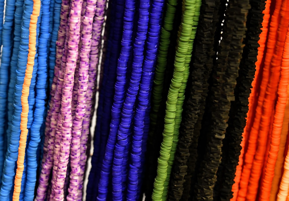 a close up of a bunch of different colored strings