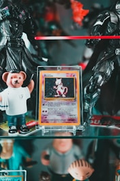 a collection of action figures and toys on a shelf