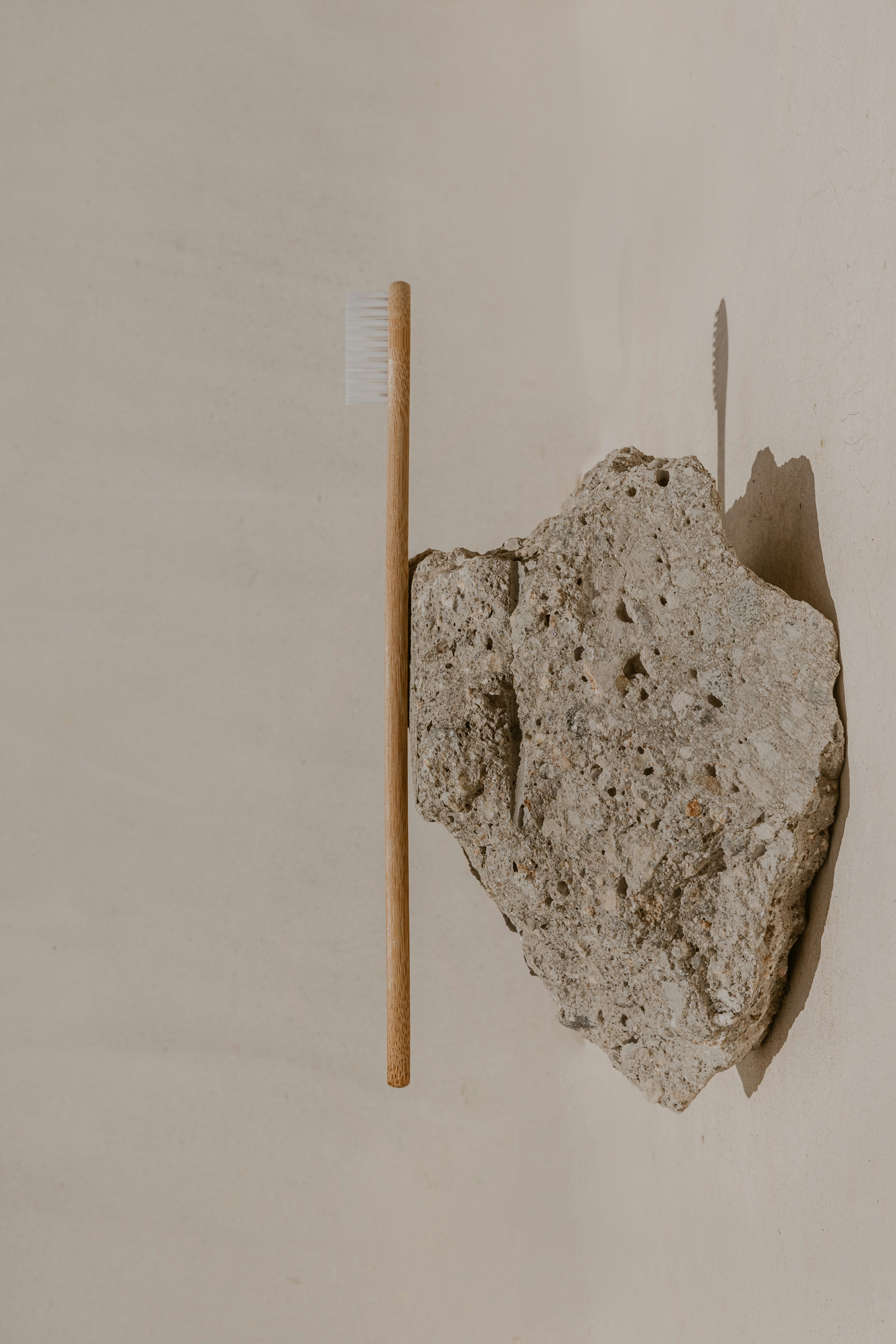 a toothbrush sitting on top of a rock
