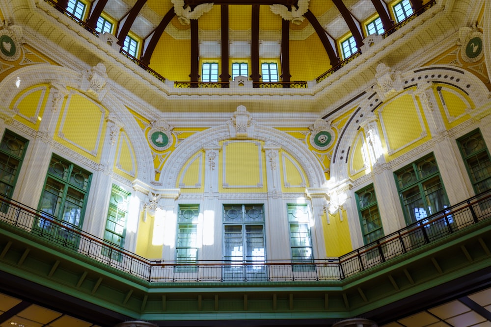 the inside of a large building with a clock on the wall