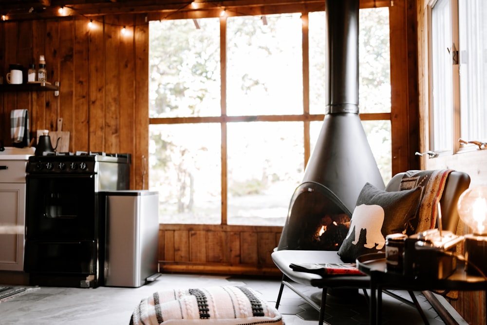 a living room with a fire place next to a window