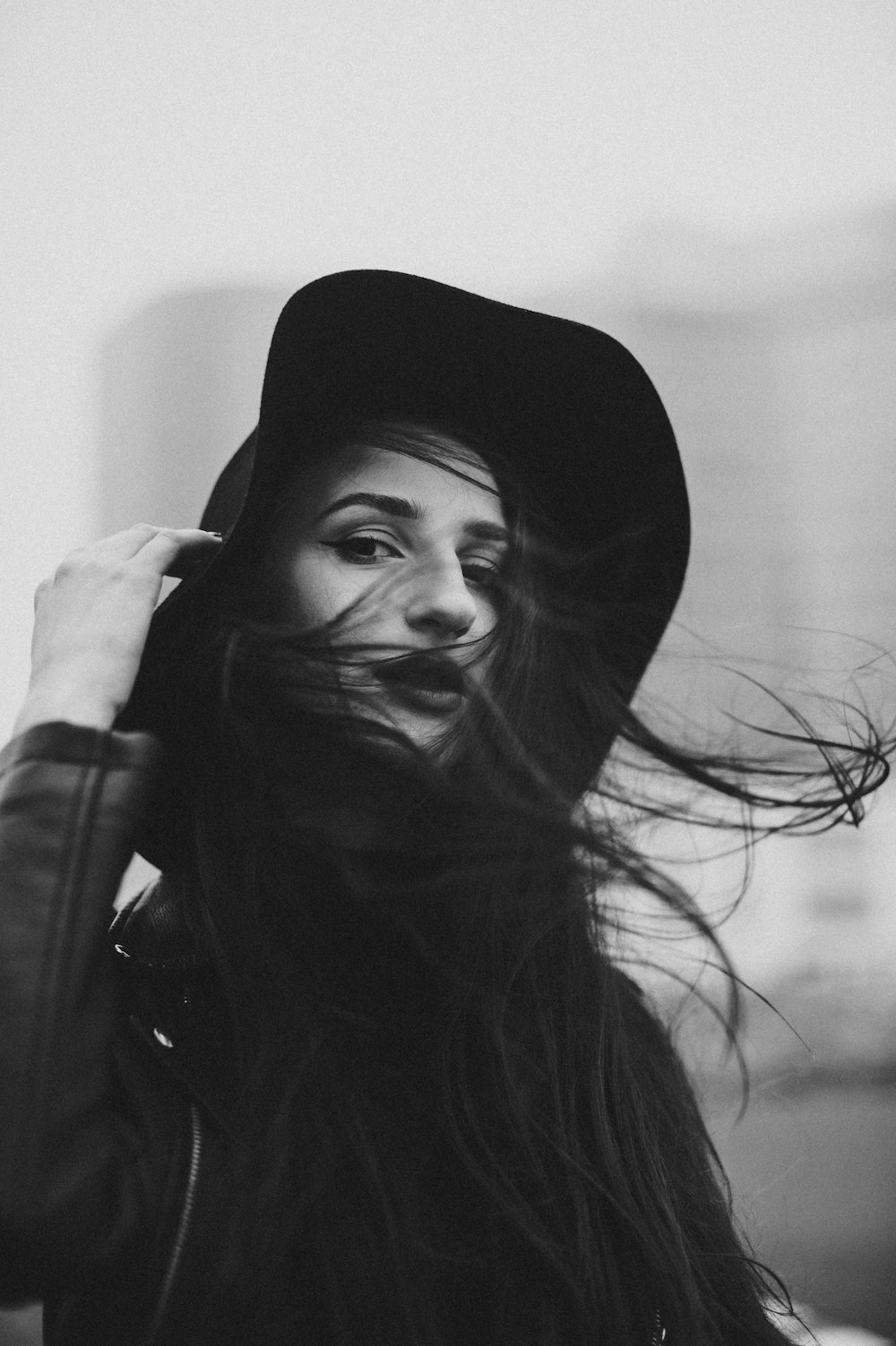 a black and white photo of a woman with long hair