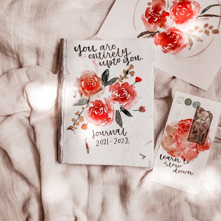 a couple of cards sitting on top of a bed