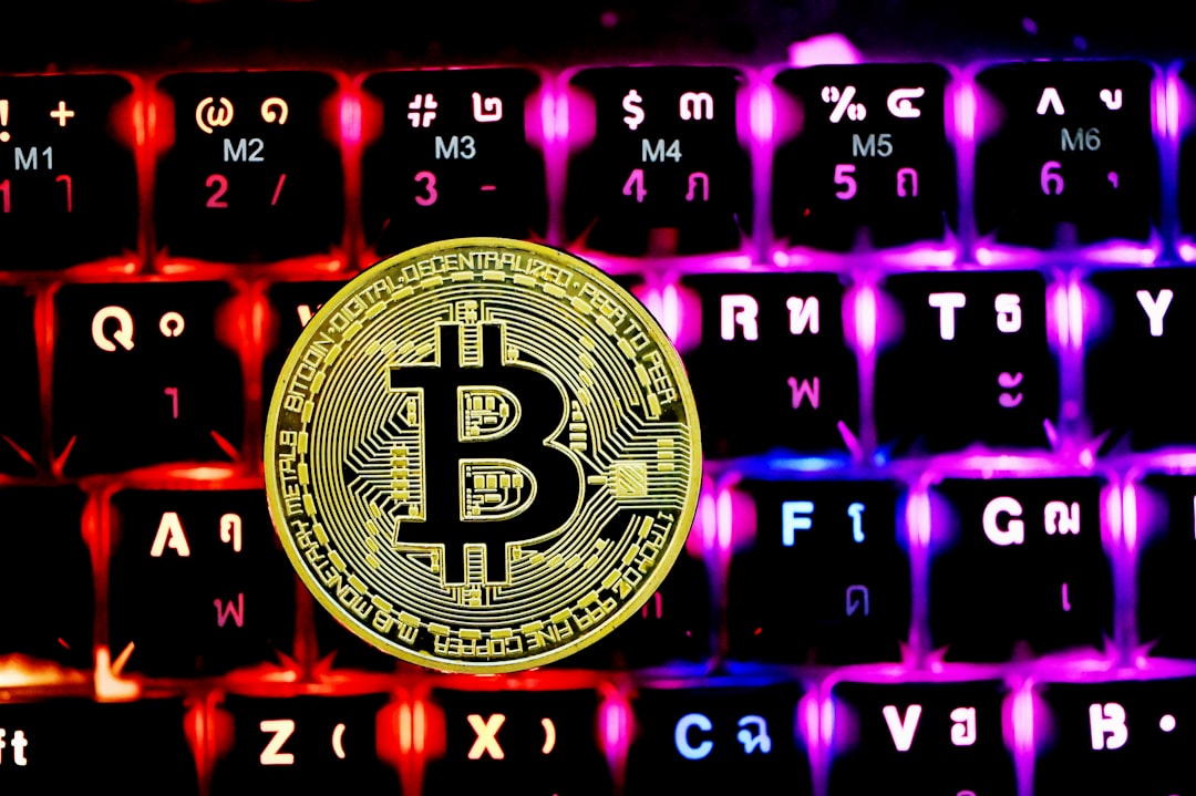 A Bitcoin on top of a keyboard
