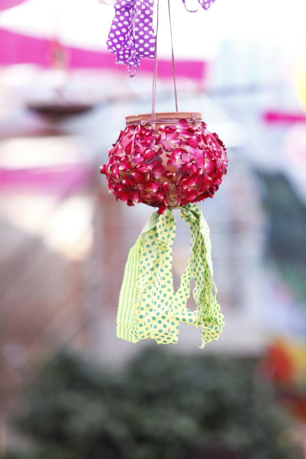 a flower pot hanging from a string in the air
