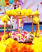 Artistic shot of the Oonjal swing decorated with flowers and silk.