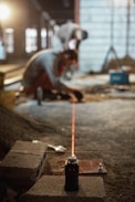 a man working on a piece of concrete
