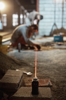 a man working on a piece of concrete