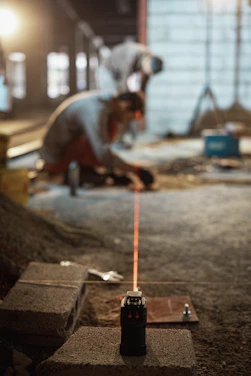 a man working on a piece of concrete
